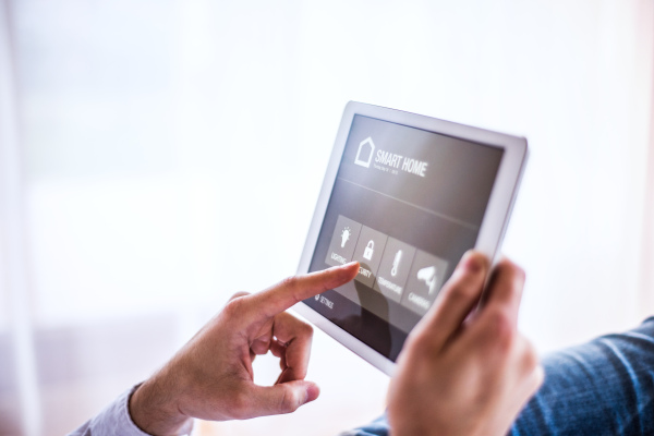 A tablet with smart home control system.