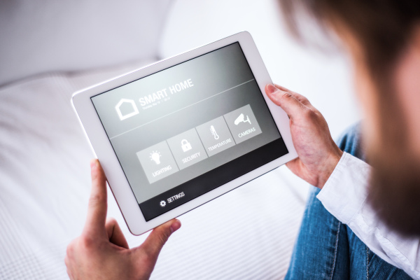 A tablet with smart home control system.