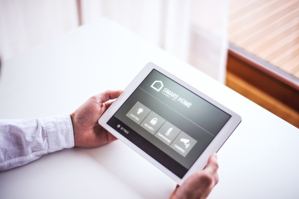 A tablet with smart home control system.