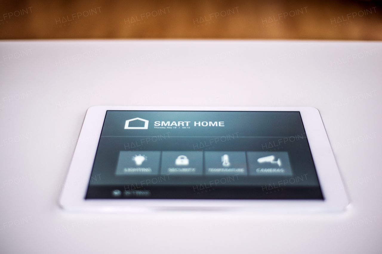 A tablet with smart home control system.