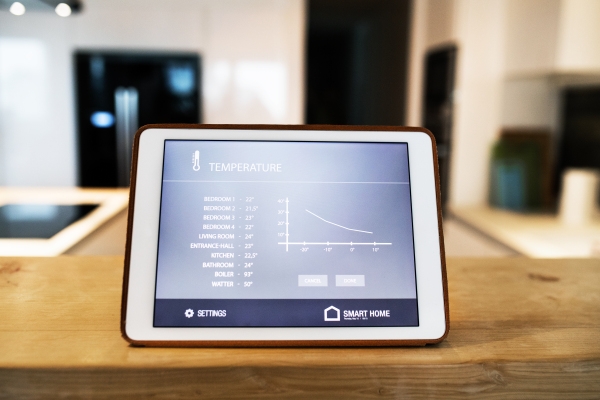 A tablet with smart home control system.