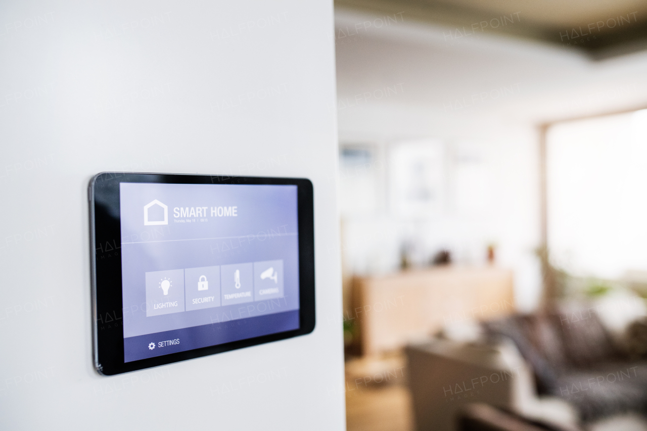 A tablet with smart home control system.