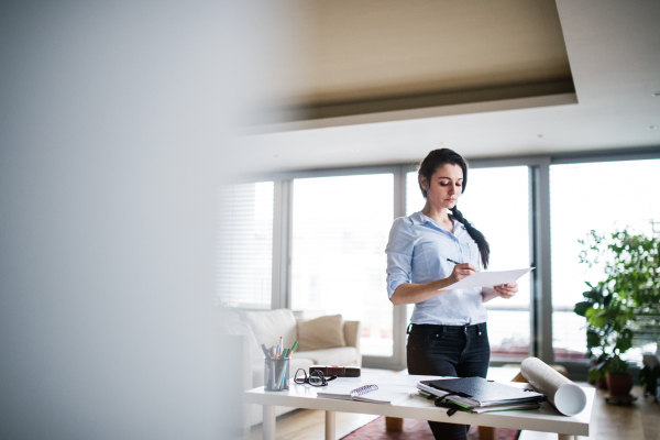 A portrait of a beautiful woman working at home.