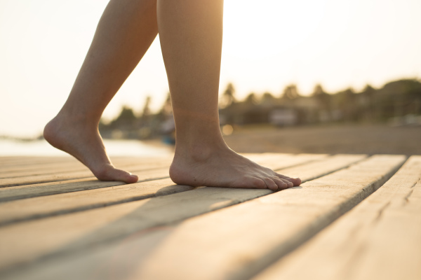 Young beautiful woman on the beach, summer time.