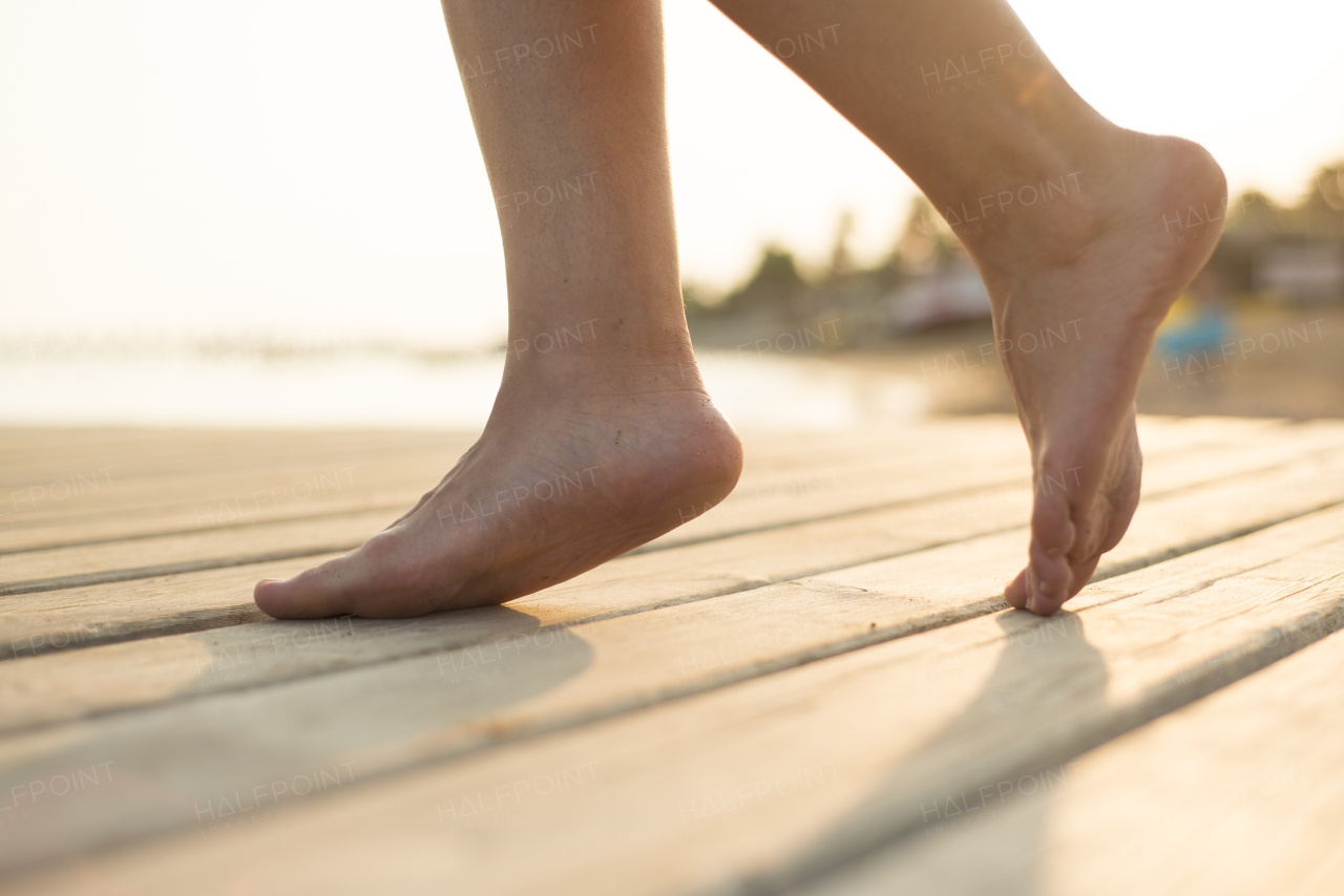 Young beautiful woman on the beach, summer time.