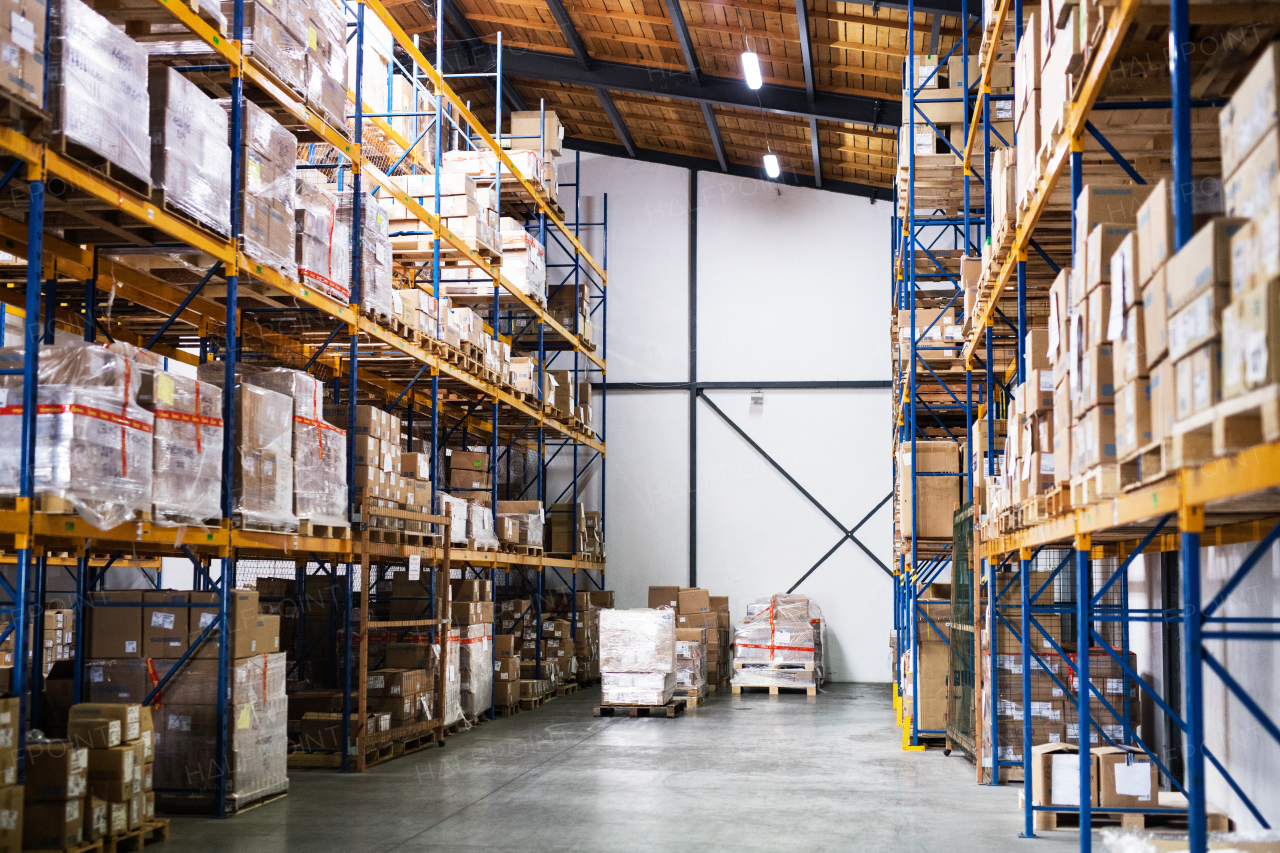 Shelves full of boxes in a warehouse.