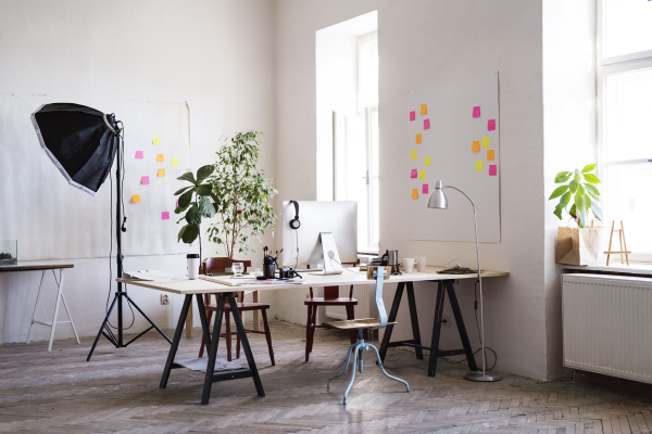 The interior of an empty modern office or a studio after work.