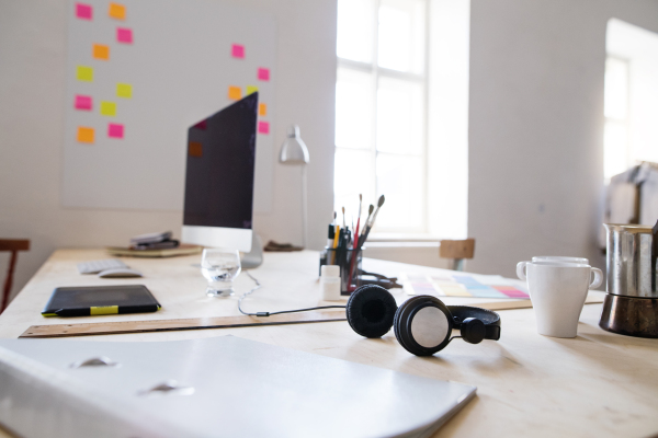 The interior of an empty modern office or a studio after work.