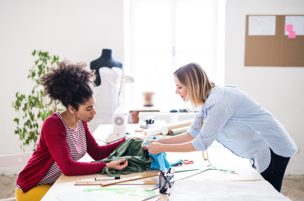 Young creative women working in a studio, startup business.