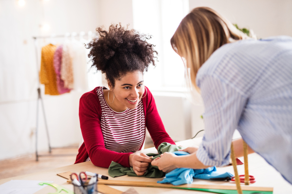 Young creative women working in a studio, startup business.