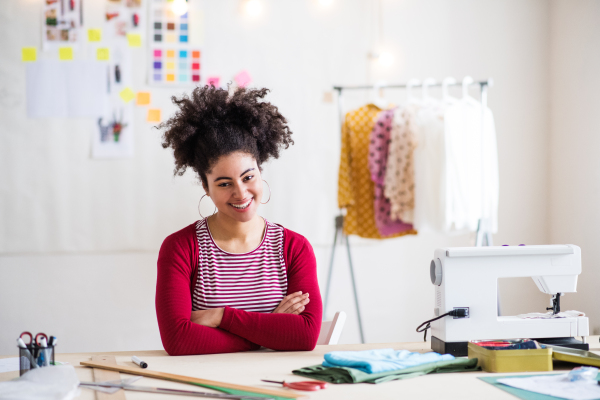 Young creative woman working in a studio, startup business.