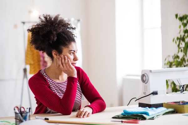 Young creative woman working in a studio, startup business.