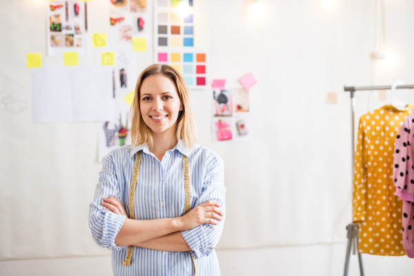 Young creative woman working in a studio, startup business.