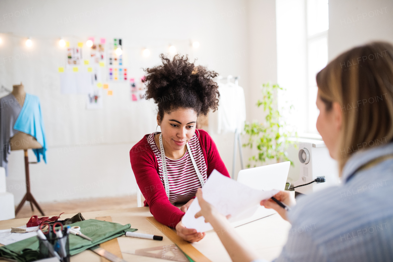 Young creative women working in a studio, startup business.