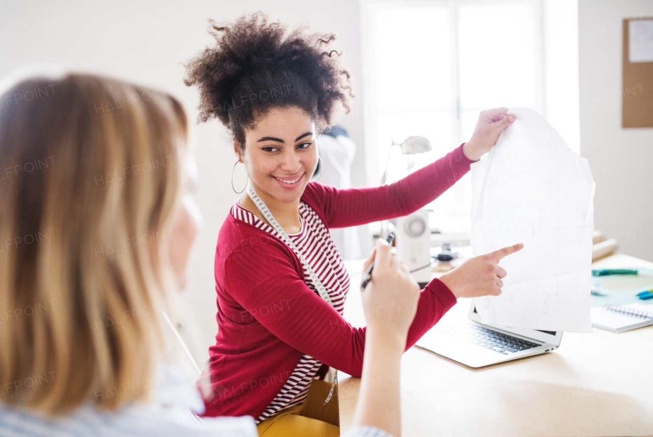 Young creative women working in a studio, startup business.