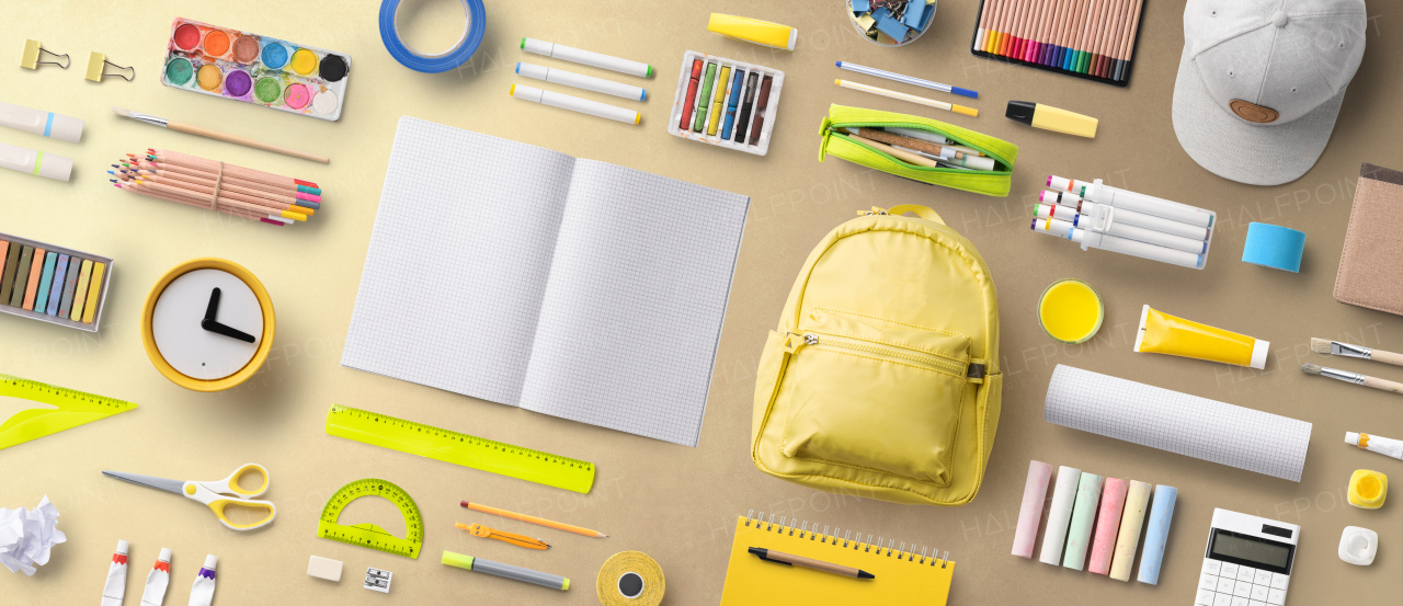 Flat lay top view of face mask, respirator and school supplies, back to school and coronavirus concept.