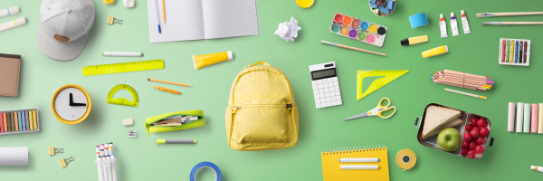 Flat lay top view of face mask, respirator and school supplies, back to school and coronavirus concept.