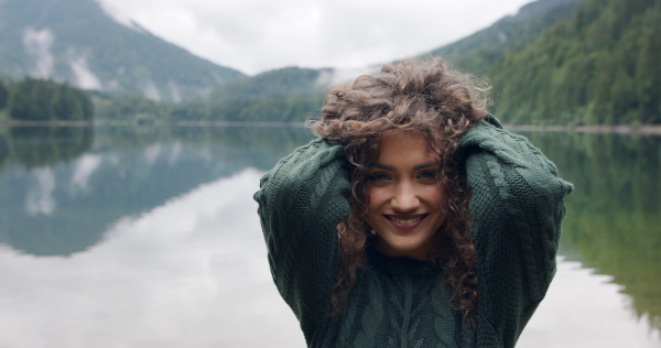 Happy young woman tourist on a hiking trip in nature.