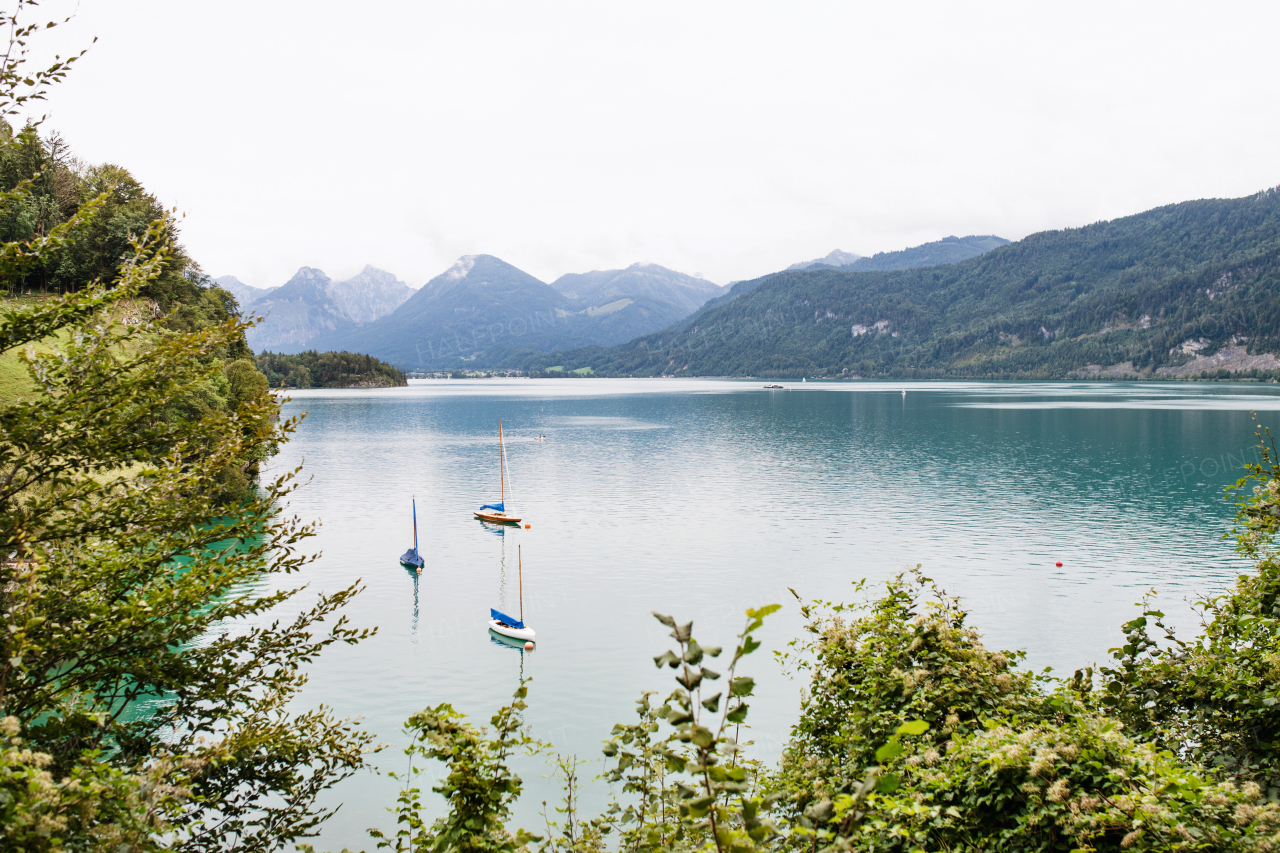 Boats on lake in the mountains, panoramic landscape. Copy space.