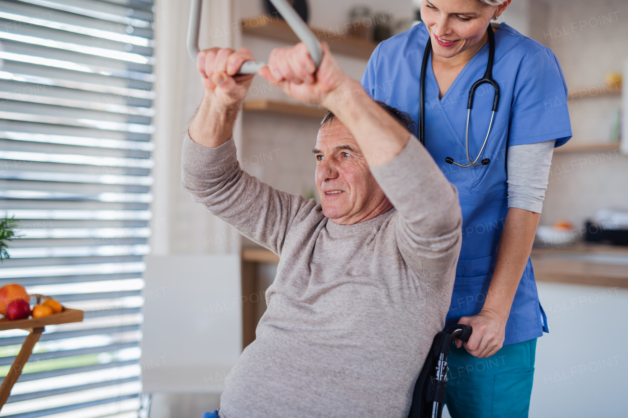 A healthcare worker and senior patient in hospital, physiotherapy concept.