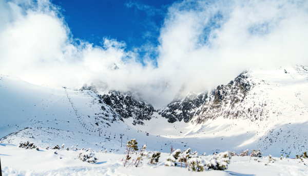 Panoramic view of snow-covered ski slope in High Tatras in Slovakia.