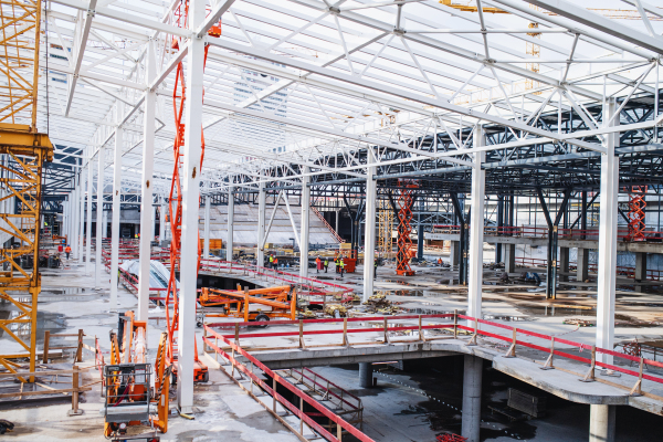 A construction site with a steel frame structures.