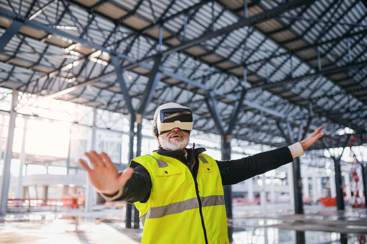 Man engineer using VR goggles outdoors on construction site.