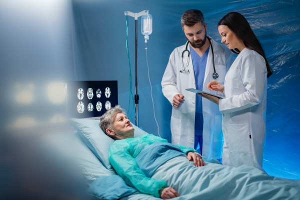 An infected patient in quarantine lying in bed in hospital, coronavirus concept.