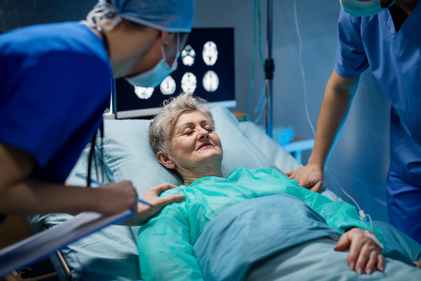 An infected patient in quarantine lying in bed in hospital, coronavirus concept.