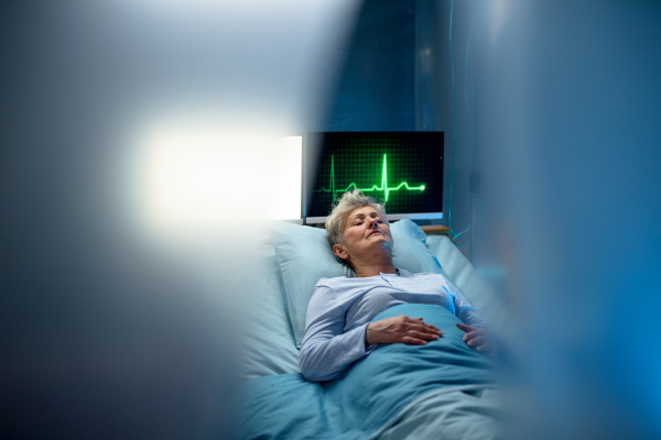 An infected patient in quarantine lying in bed in hospital, coronavirus concept.