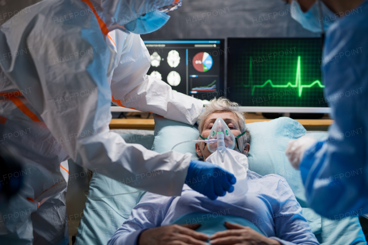 An infected patient in quarantine lying in bed in hospital, coronavirus concept.