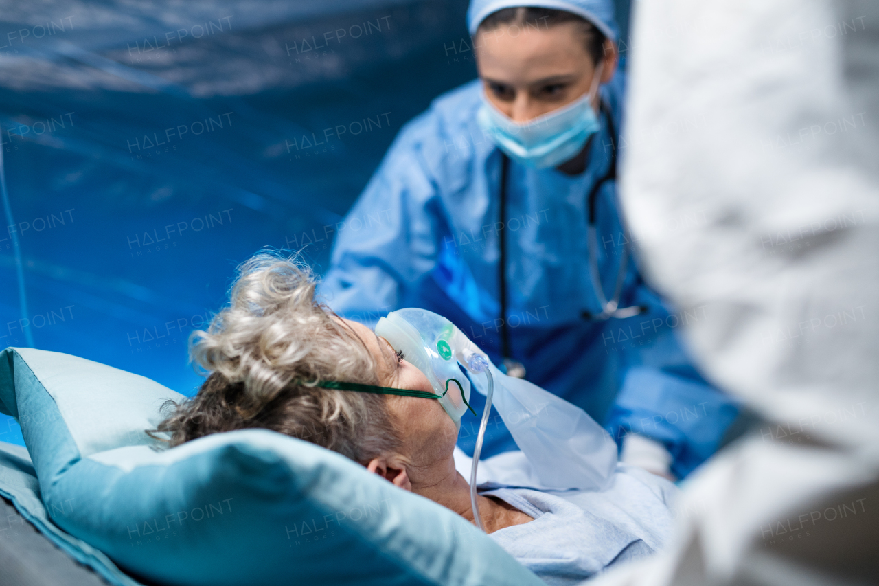 An infected patient in quarantine lying in bed in hospital, coronavirus concept.