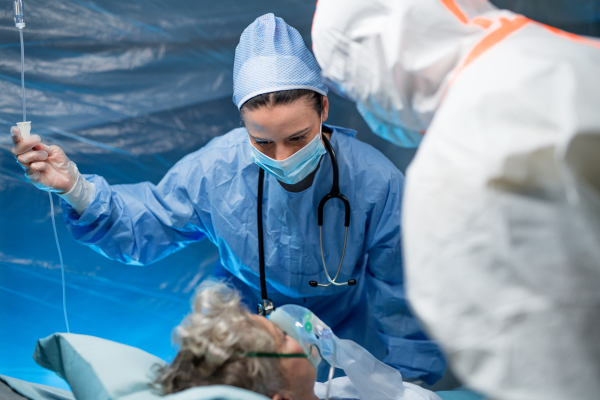 An infected patient in quarantine lying in bed in hospital, coronavirus concept.