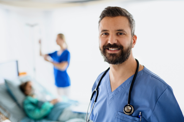 Portrait of doctors and infected patient in hospital looking at camera, coronavirus concept.