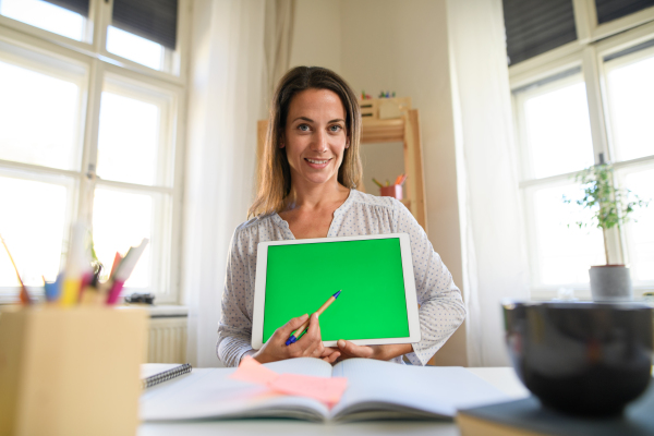 Portrait of woman teacher teaching online, coronavirus,online distance learning and keyable screen concept.