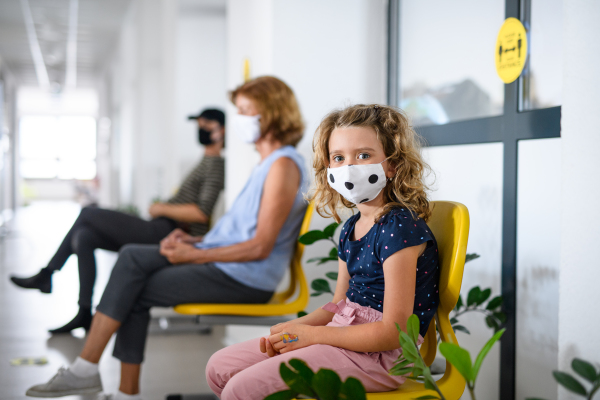 Portrait of small child with face mask, coronavirus, covid-19 and vaccination concept.