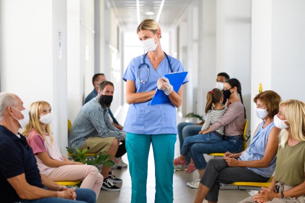 Portrait of doctor and people with face masks, coronavirus, covid-19 and vaccination concept, waiting.