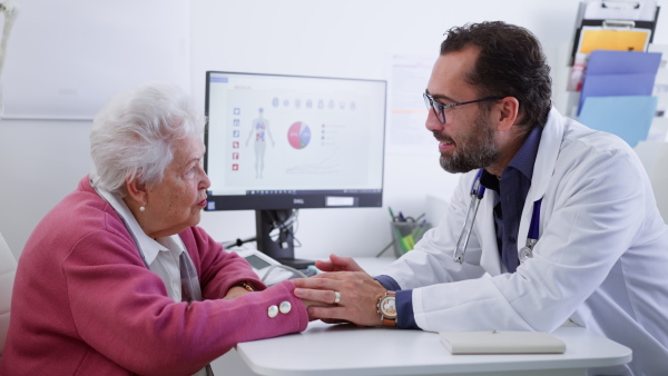 A senior woman on consultation with doctor in his office.