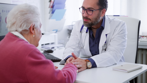 A senior woman on consultation with doctor in his office.