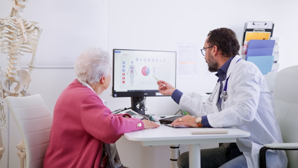 A senior woman on consultation with doctor in his office.