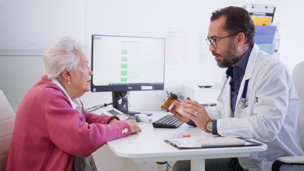 A senior woman on consultation with doctor in his office.