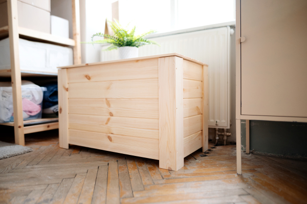 A wooden furniture box indoors in office, natural decor concept.