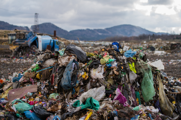 Heaps of waste on landfill, environmental concept. Copy space.