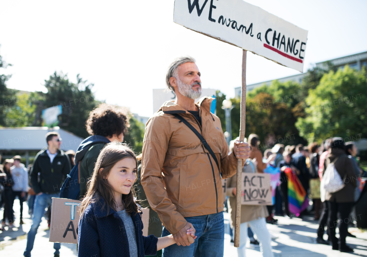 People with placards and posters on a global strike for climate change.