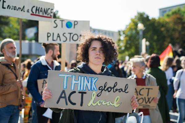 People with placards and posters on a global strike for climate change.