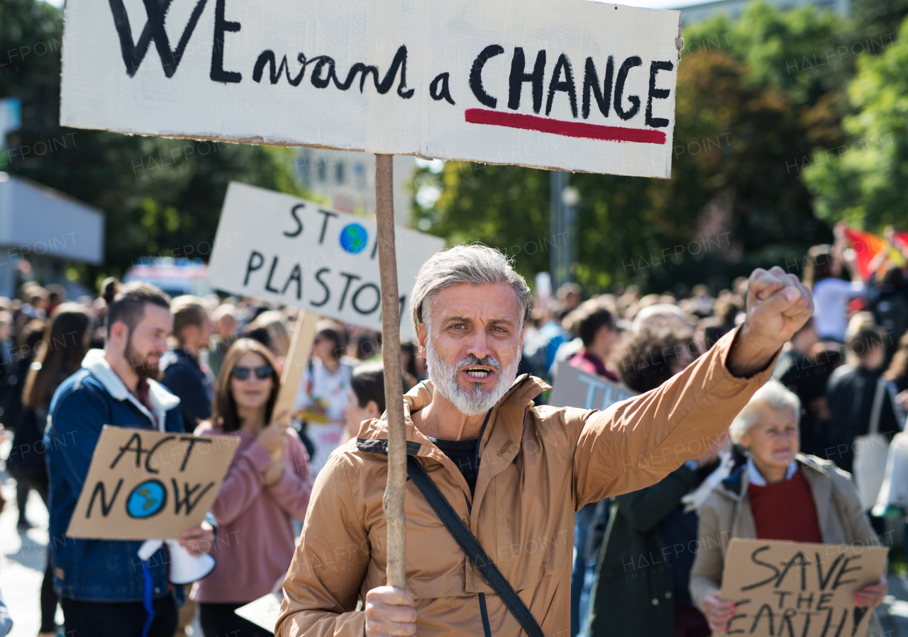 People with placards and posters on a global strike for climate change.