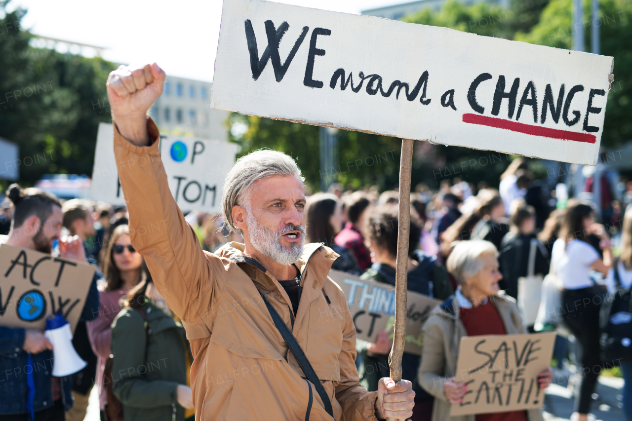 People with placards and posters on a global strike for climate change.