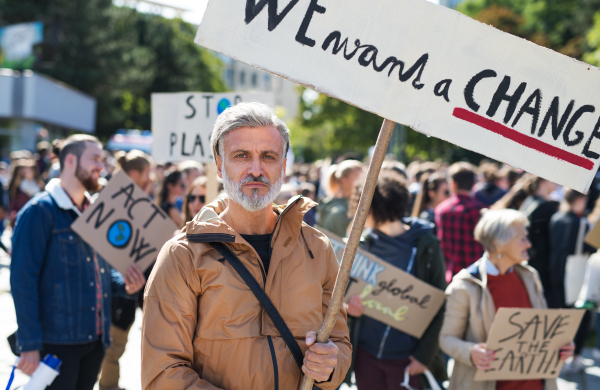 People with placards and posters on a global strike for climate change.