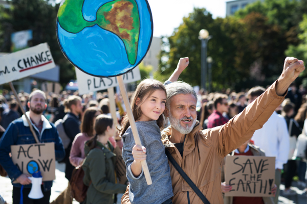 People with placards and posters on a global strike for climate change.