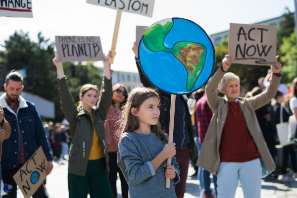 People with placards and posters on a global strike for climate change.